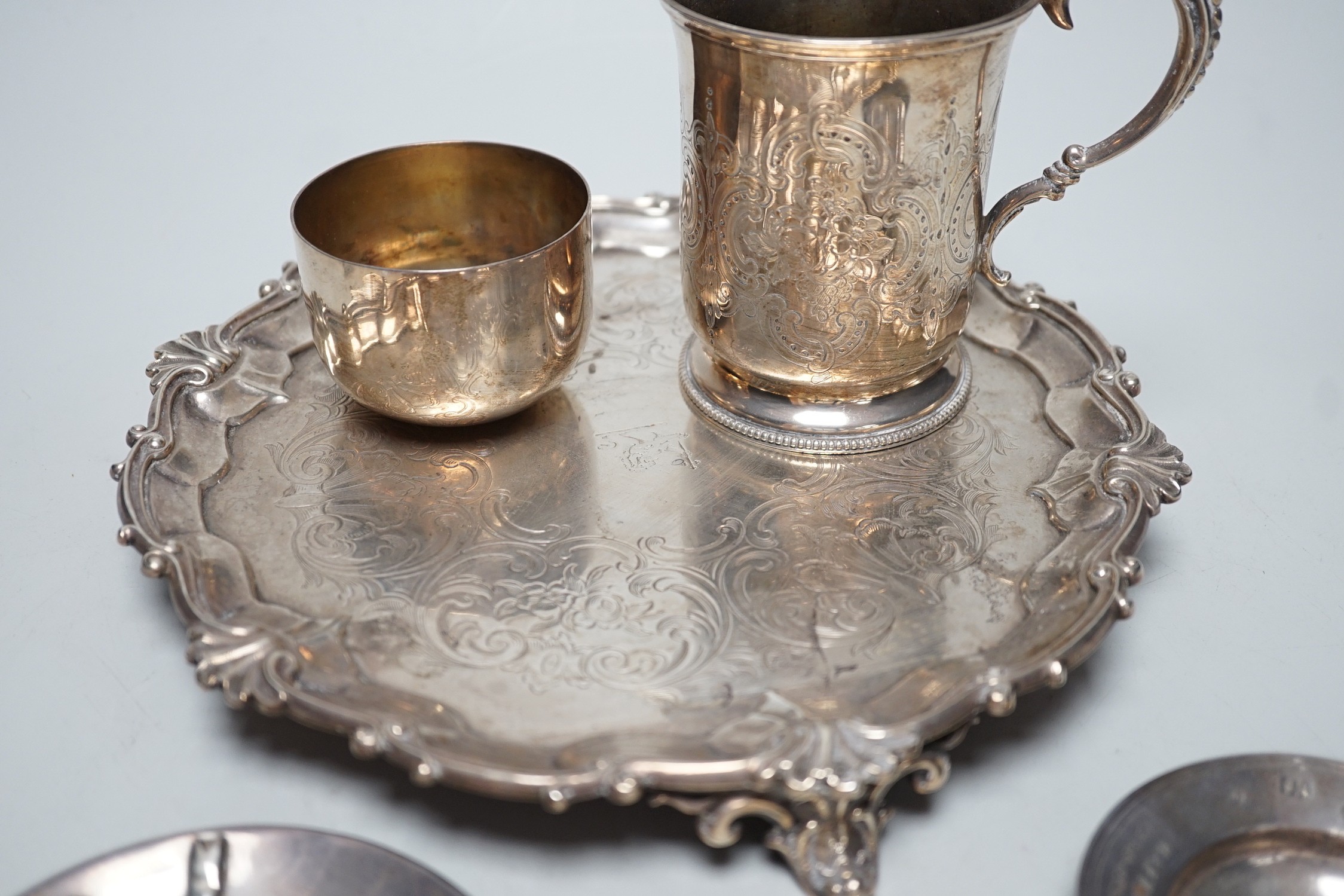 A Victorian silver salver, by The Barnards, London, 1847, 23.1cm, together with a chased silver christening cup, a presentation pin dish, a further novelty dish in the form of a bonnet and a George III silvetr tumbler cu